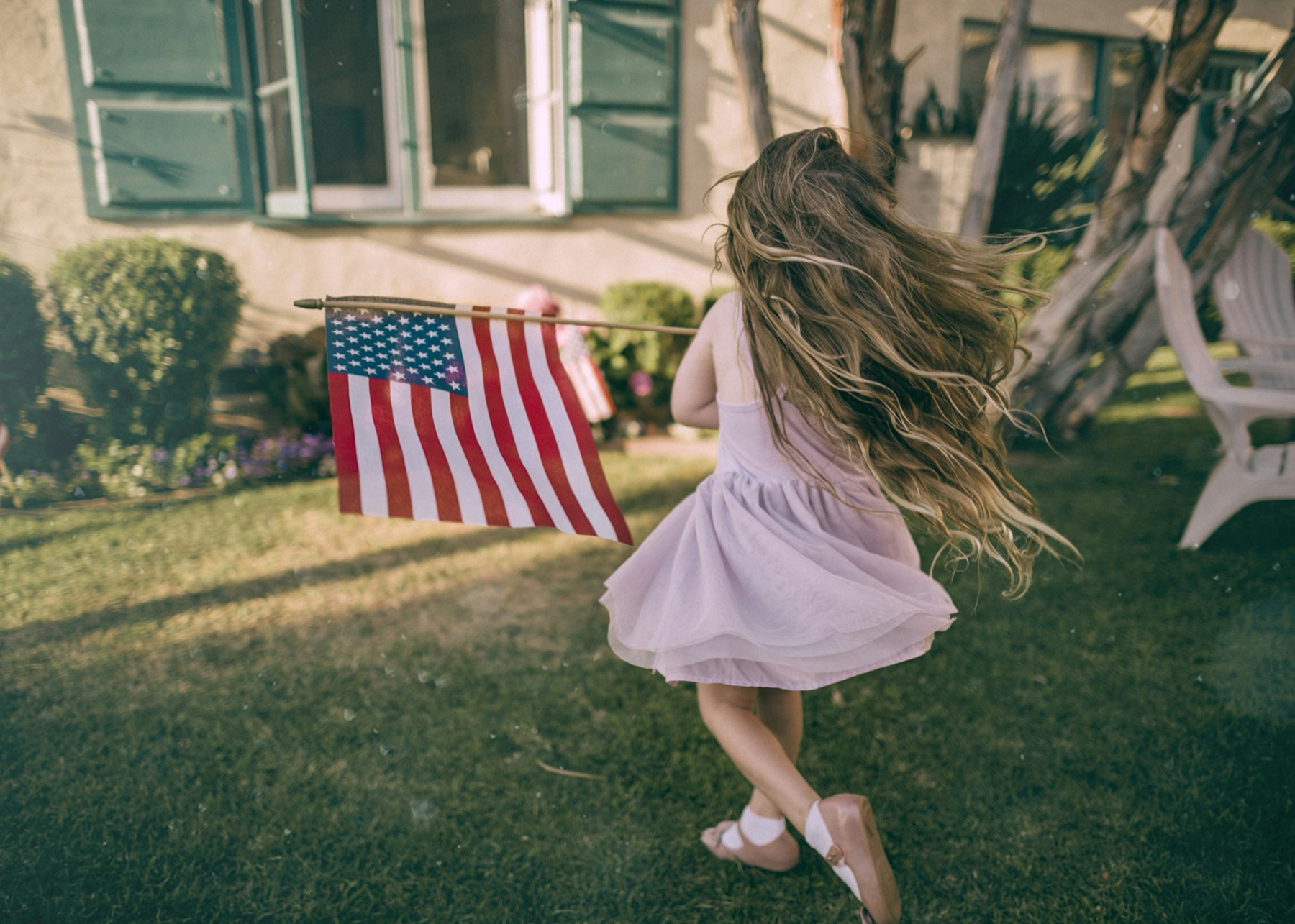 Child holding an American flag