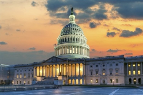 Capitol Building with sunset behind it